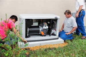 generator being installed by two technicians