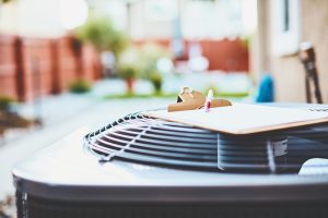 air-conditioner-with-clipboard-sitting-on-it