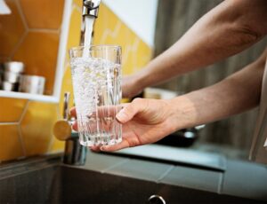 hand-holding-glass-of-water