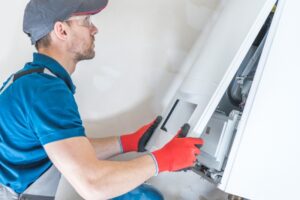 technician-working-on-furnace 