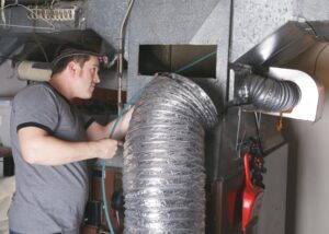 technician-working-on-ductwork