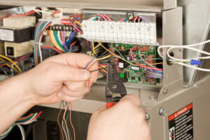 hands-working-on-electrical-wiring