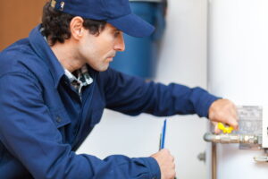 Technician beginning to replace a water boiler.